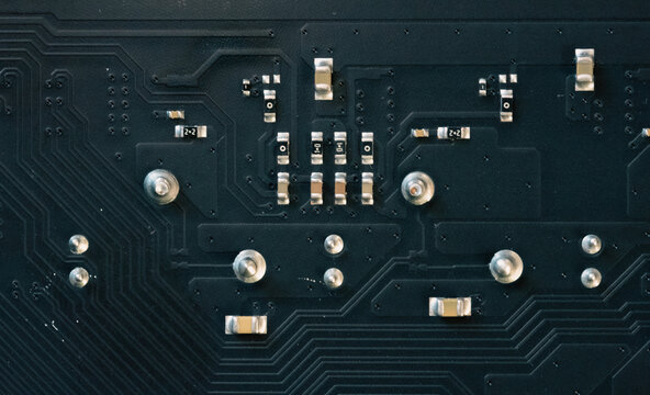 Electronic circuit board featuring multiple capacitors and integrated electronic processing modules.
