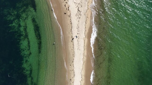 drone rising above a north point. beach on block island