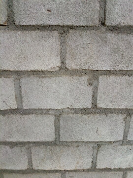 Close up view of grey concrete block wall texture background