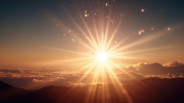 Golden sunrise above the clouds with radiant sunbeams over mountain landscape