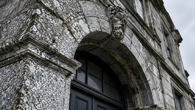 carved granite keystone arch over entrance of old grain exchange