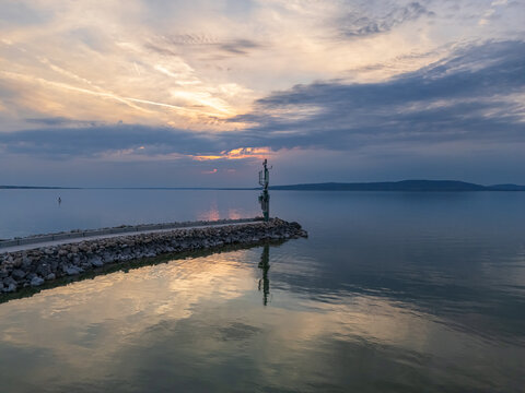 Aerial view of a radio tower near a marine on Lake Balaton at blue hour glow