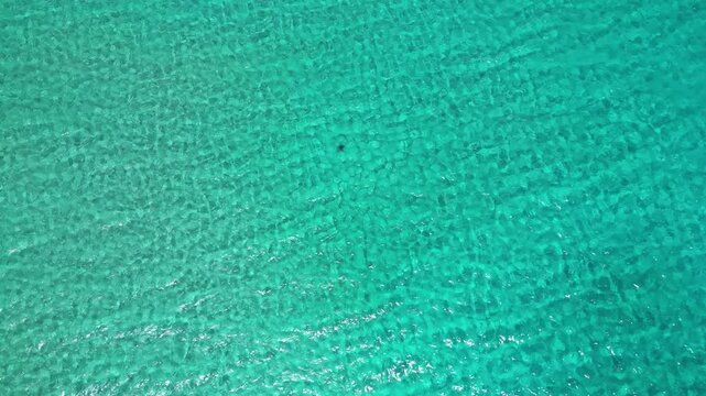 Abstract Aerial Texture of Clear Turquoise Sea Water in Milos