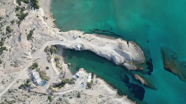 Aerial of Rocky Isthmus Between Turquoise Lagoons at Coastal Beach