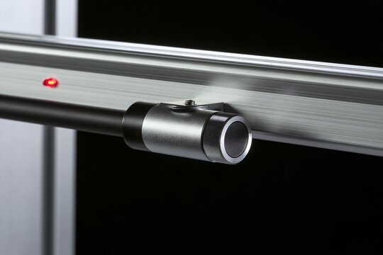 Proximity sensor on an aluminium rail with an indicator light, factory sensing concept