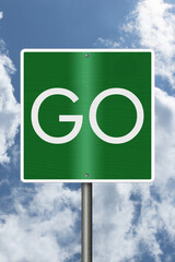 Green Go sign with sky © Karen Roach