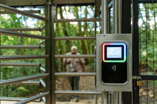 Electronic turnstile scanning access card entering nature park