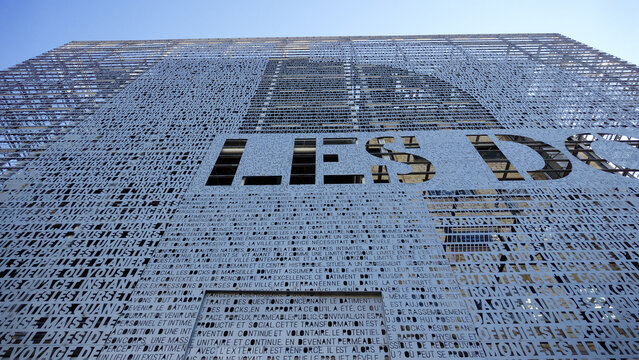 MARSEILLE, FRANCE - SEPTEMBER 16, 2026 - Modern architectural facade with words and typography, representing urban renewal and cultural connection