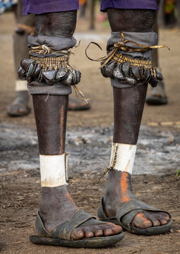 Bodi woman with painted cheek at Kael ceremony, Hana, Ethiopia