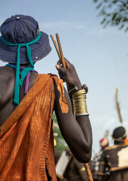 Bodi man in cowry face net at Kael ceremony, Hana, Ethiopia