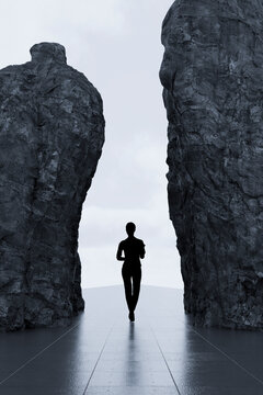 3D lone silhouette crossing narrow passage between monumental dark rock walls