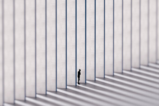 3D lone silhouette between repeating white walls and long shadows in minimalist architecture
