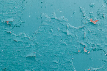 Weathered turquoise surface reveals layers of peeling paint, exposed rust, and aged metal beneath. The distressed texture creates a striking abstract background with rich teal, blue, and warm oxidized © TS-photo
