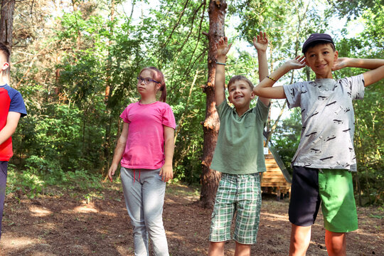 Children with Down syndrome are vacationing at a camp.