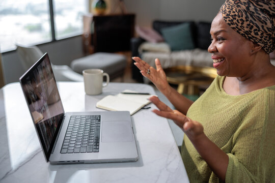 Smiling woman engaging in a remote video call