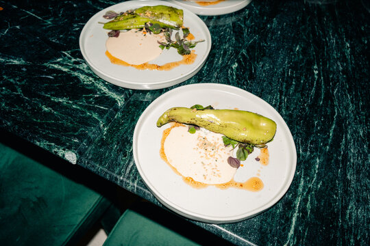 Dinner Plates With Food at a Restaurant Table in the Evening