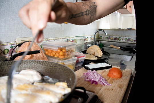 Cooking Food in a Kitchen While Preparing Ingredients