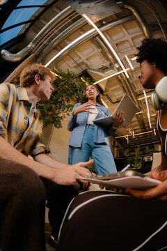 A group of diverse people participating in a creative work discussion