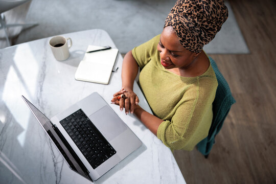 Professional woman working remotely at her desk