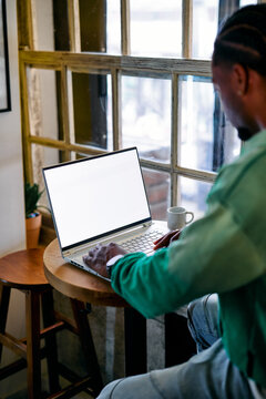 Black Man Working on Laptop with Blank Screen Mockup