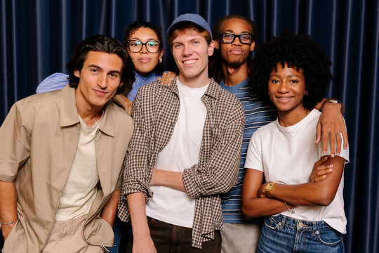 Diverse team of creative people posing together smiling.