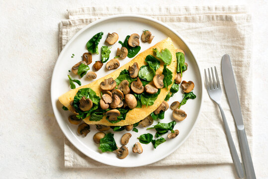 Delicious omelette with mushrooms and spinach