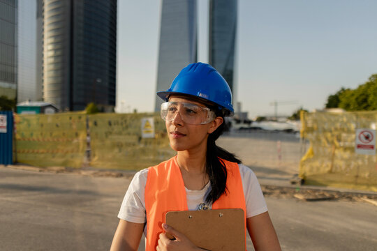 Woman engineer supervising construction site development