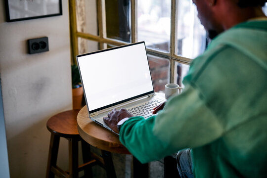Black Man Working on Laptop with Blank Screen Mockup