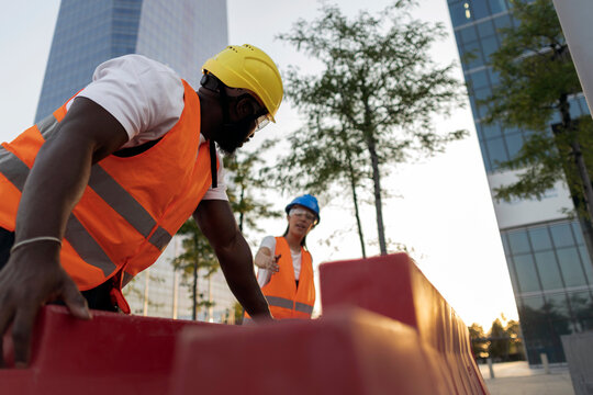 Diverse construction team collaborating on urban