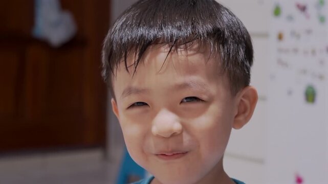 Portrait footage of Asian Chinese kids expressing happiness and playful emotion