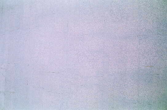 Pale lavender wall with fine cracks and wear