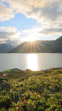 Sunset against the backdrop of the Norwegian mountains. Beautiful Nature Norway natural landscape.