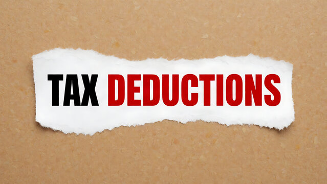 Torn paper with tax deductions text on brown cardboard background