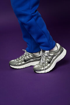 Riga, Latvia - August 03 2026 - Closeup of a new NIKE sport shoes isolated on purple background