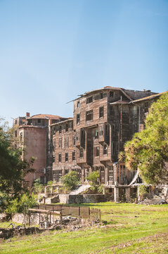 Abandoned wooden building with weathered facade showing decay and forgotten charm