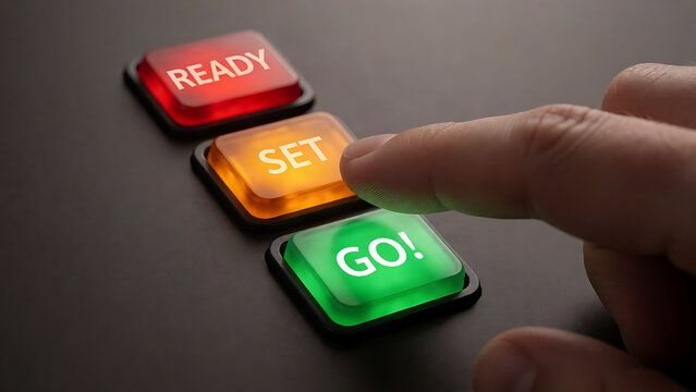 Finger pressing green GO button on ready set go control panel