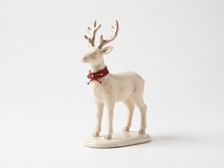 Ceramic reindeer figurine with red ribbon for Christmas holiday decor © kavindu