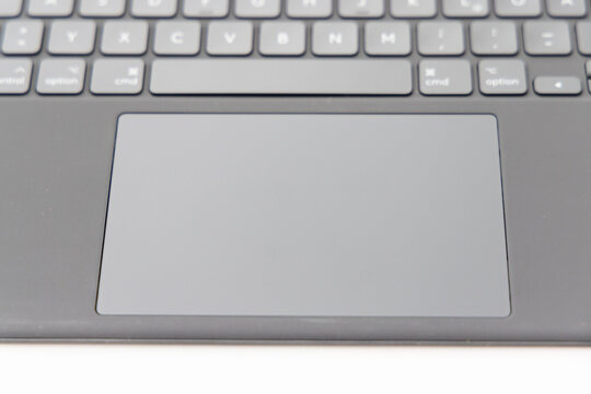 Close up of modern computer keyboard and trackpad surface