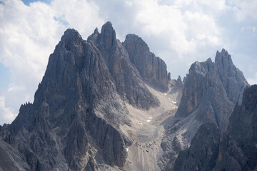 Obraz premium Mountain landscape panorama Tre Cime Mount against a blue summer background. 