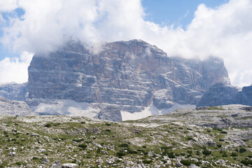 Obraz premium Mountain landscape panorama Tre Cime Mount against a blue summer background. 