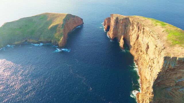 Cabras Islets and Atlantic Ocean at Sunset. Steep Cliffs. Terceira Island, Azores, Portugal. Aerial View. Orbiting