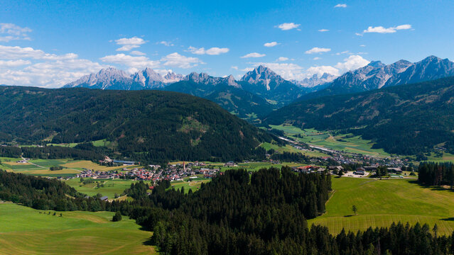 Majestic scenery of rough mountain ridge near grassy hills 