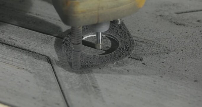A high-precision CNC routing process of material for yacht and motorboat deck flooring. The working cutter is carving longitudinal grooves and channels on a panel used for ship deck finishing. 