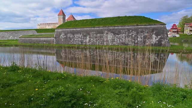 Medieval Kuressaare Castle reflected in the water moat