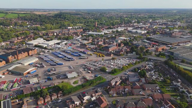 Wide aerial view of industrial estate and town landscape