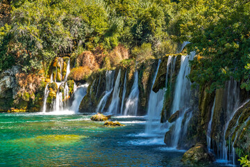 Beautiful Kravice waterfalls in Bosnia and Herzegovina with turquoise water and lush green forest © ronedya