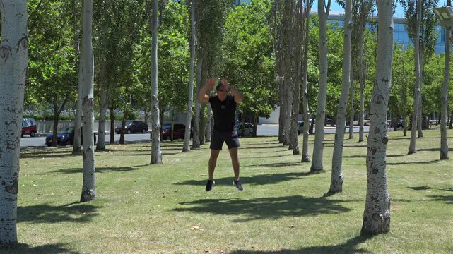 Athlete performing burpees during an outdoor functional training session