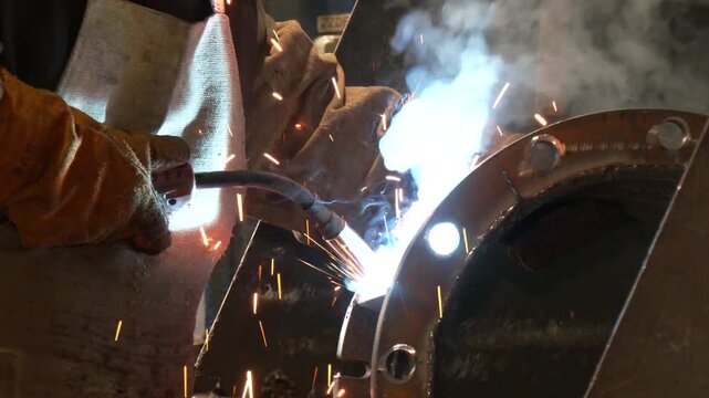 Welding of steels with Mig welding, flange nozzle welding master. Welder working on flange for new line manufacturing
