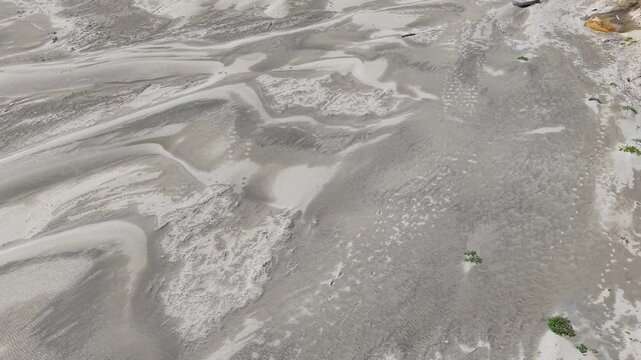 OREGON - 9.2.2026 - Amazing overhead footage of Oregon's Hobbit Beach ultimately tilts up to reveal a couple walking by the water.