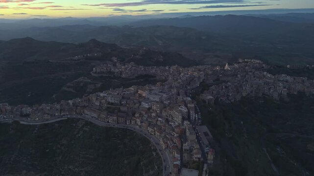 Aerial view of the historic town of Centuripe with its unique human-shaped layout nestled in the hills of Sicily, Centuripe, Sicily, Italy.